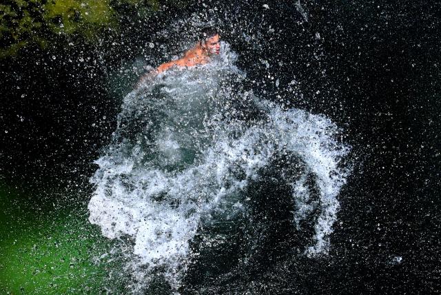 (260731) -- SKOPJE, July 31, 2026 (Xinhua) -- A man cools off in the Treska River to escape the summer heat near Skopje, North Macedonia, July 31, 2026. (Photo by Tomislav Georgiev/Xinhua)