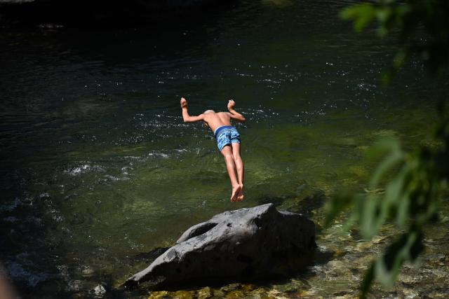 (260731) -- SKOPJE, July 31, 2026 (Xinhua) -- A man dives at the Treska River to escape the summer heat near Skopje, North Macedonia, July 31, 2026. (Photo by Tomislav Georgiev/Xinhua)