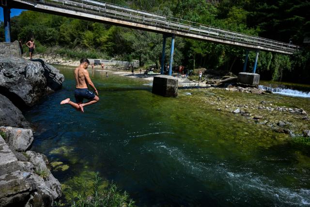 (260731) -- SKOPJE, July 31, 2026 (Xinhua) -- A man dives at the Treska River to escape the summer heat near Skopje, North Macedonia, July 31, 2026. (Photo by Tomislav Georgiev/Xinhua)