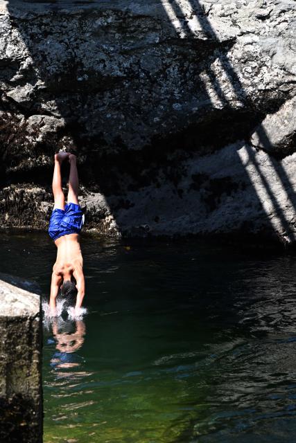 (260731) -- SKOPJE, July 31, 2026 (Xinhua) -- A man dives at the Treska River to escape the summer heat near Skopje, North Macedonia, July 31, 2026. (Photo by Tomislav Georgiev/Xinhua)