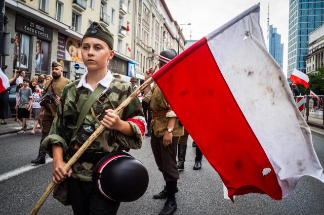(260802) -- WARSAW, Aug. 2, 2026 (Xinhua) -- People take part in a march commemorating the 82nd anniversary of the Warsaw Uprising in Warsaw, Poland, Aug. 1, 2026. The Warsaw Uprising, which broke out on Aug. 1, 1944, was the largest underground military operation in German-occupied Europe. Around 40,000-50,000 Polish insurgents took part in the two-month struggle, which resulted in the deaths of approximately 18,000 fighters and up to 180,000 civilians. (Photo by Jaap Arriens/Xinhua)