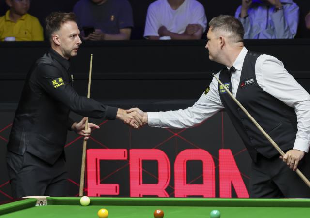 (260802) -- SHANGHAI, Aug. 2, 2026 (Xinhua) -- Judd Trump (L) shakes hands with Kyren Wilson before the final match between Judd Trump of England and Kyren Wilson of England at the World Snooker Shanghai Masters 2026 in Shanghai, east China, Aug. 2, 2026. (Xinhua/Chen Haoming)