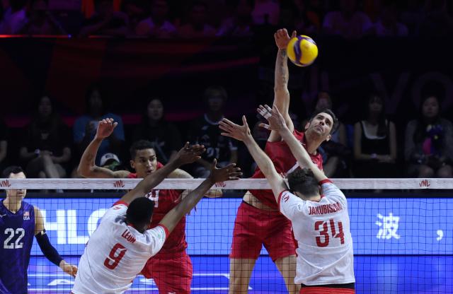 (260802) -- NINGBO, Aug. 2, 2026 (Xinhua) -- Matthew Anderson (top) of the United States spikes the ball during the final match between Poland and the United States at the 2026 Volleyball Nations League (VNL) Men's Final Round in Ningbo, east China's Zhejiang Province, Aug. 2, 2026. (Photo by Suo Xianglu/Xinhua)