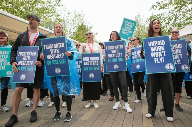 (260802) -- VANCOUVER, Aug. 2, 2026 (Xinhua) -- WestJet flight attendants strike at Vancouver International Airport in Richmond, British Columbia, Canada, on Aug. 2, 2026. Canada's second-largest airline, WestJet, was hit by a flight attendants' strike on Sunday, triggering hundreds of flight cancellations during one of the busiest travel weekends of the summer. (Photo by Liang Sen/Xinhua)