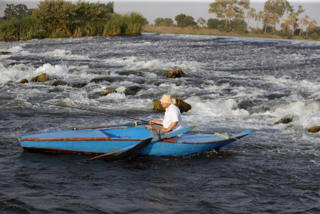 (260802) -- CAIRO, Aug. 2, 2026 (Xinhua) -- A man fishes at a riffle on the Nile River to escape the heat of summer in Qalyubia Governorate, Egypt, on August 2, 2026. (Photo by Ahmed Gomaa/Xinhua)