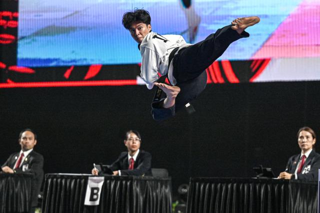 (260803) -- JAKARTA, Aug. 3, 2026 (Xinhua) -- Andi Sultan of Indonesia competes during the Men Over 17 Poomsae Freestyle Individual of Taekwondo on the 8th Asian Taekwondo Indonesia Open Championships 2026 in Jakarta, Indonesia, Aug. 2, 2026. (Xinhua/Agung Kuncahya B.)
