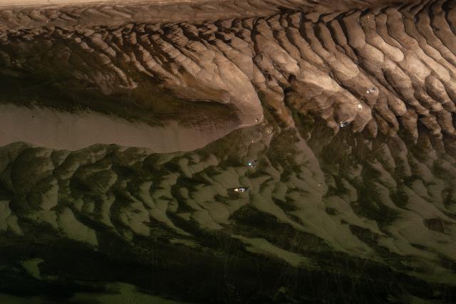 (260803) -- BUDAPEST, Aug. 3, 2026 (Xinhua) -- An aerial drone photo taken on Aug. 2, 2026 shows the exposed riverbed of the Danube River in Dunaszentbenedek, Hungary. Hungary is entering its "most critical 5 days" as dropping water levels on the Danube River threaten the complete shutdown of the Paks nuclear power plant amid an extreme heatwave, Hungary's Prime Minister Peter Magyar said on Sunday, warning that the plant could be shut down for more than a month. (Photo by David Balogh/Xinhua)