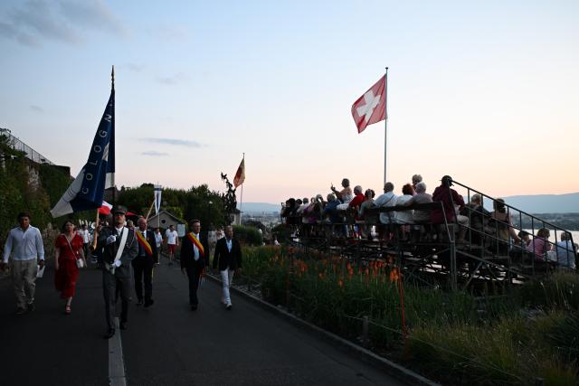(260803) -- BEIJING, Aug. 3, 2026 (Xinhua) -- People attend an event to celebrate the Swiss National Day in Geneva, Switzerland, Aug. 1, 2026. (Xinhua/Lian Yi)