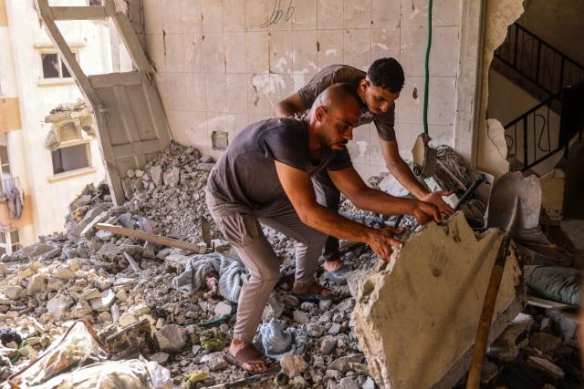 (260803) -- GAZA, Aug. 3, 2026 (Xinhua) -- Palestinians check the ruins after an Israeli airstrike hit an apartment in Gaza City, on Aug. 2, 2026. At least 18 Palestinians were killed in Israeli airstrikes on the Gaza Strip since dawn on Sunday, despite announcements of progress in efforts to implement a ceasefire agreement.
  The strikes targeted residential apartments, tents sheltering displaced people, civilian vehicles, and Palestinian gatherings from the north to the south of the Gaza Strip, resulting in the deaths of at least 18 people, including four children and two women, said Mahmoud Basal, spokesperson for the Civil Defense in Gaza. (Photo by Rizek Abdeljawad/Xinhua)