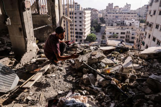 (260803) -- GAZA, Aug. 3, 2026 (Xinhua) -- A Palestinian checks the ruins after an Israeli airstrike hit an apartment in Gaza City, on Aug. 2, 2026. At least 18 Palestinians were killed in Israeli airstrikes on the Gaza Strip since dawn on Sunday, despite announcements of progress in efforts to implement a ceasefire agreement.
  The strikes targeted residential apartments, tents sheltering displaced people, civilian vehicles, and Palestinian gatherings from the north to the south of the Gaza Strip, resulting in the deaths of at least 18 people, including four children and two women, said Mahmoud Basal, spokesperson for the Civil Defense in Gaza. (Photo by Rizek Abdeljawad/Xinhua)