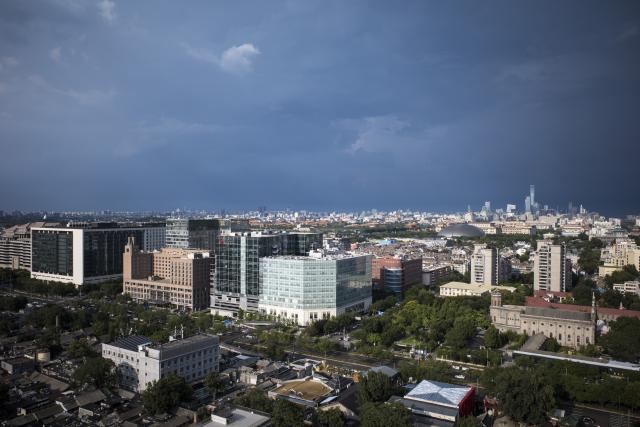 (260803) -- BEIJING, Aug. 3, 2026 (Xinhua) -- This photo taken on Aug. 3, 2026 shows a view after rain in downtown Beijing, capital of China. (Xinhua/Zhang Xiaoyu)