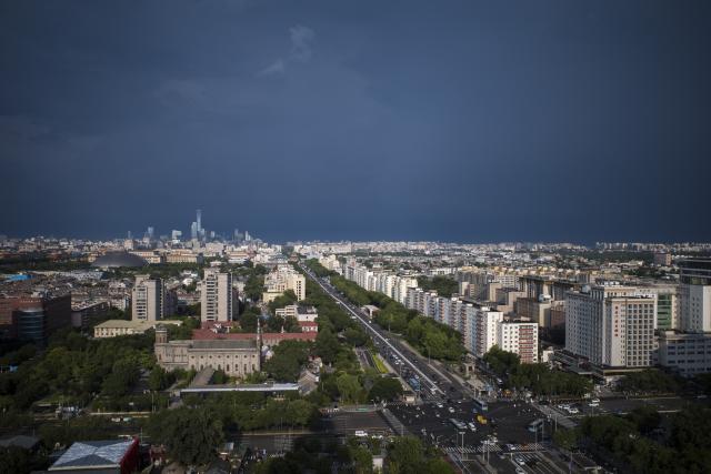 (260803) -- BEIJING, Aug. 3, 2026 (Xinhua) -- This photo taken on Aug. 3, 2026 shows a view after rain in downtown Beijing, capital of China. (Xinhua/Zhang Xiaoyu)