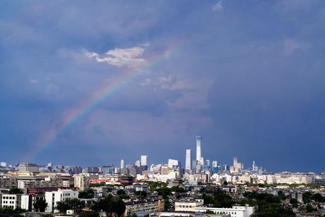 (260803) -- BEIJING, Aug. 3, 2026 (Xinhua) -- A rainbow appears in the sky after rain in Beijing, capital of China, Aug. 3, 2026. (Xinhua/Du Juanjuan)