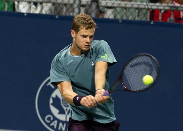 (260804) -- MONTREAL, Aug. 4, 2026 (Xinhua) -- Yannick Hanfmann of Germany hits a return against Benjamin Bonzi of France during the men's singles first round match at the 2026 National Bank Open tennis tournament in Montreal, Canada, Aug. 3, 2026. (Photo by Li Haitao/Xinhua)