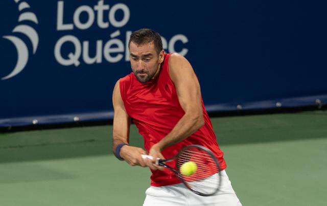 (260804) -- MONTREAL, Aug. 4, 2026 (Xinhua) -- Marin Cilic of Croatia hits a return against Shimabukuro Sho of Japan during the men's singles first round match at the 2026 National Bank Open tennis tournament in Montreal, Canada, Aug. 3, 2026. (Photo by Li Haitao/Xinhua)