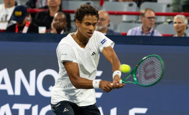 (260804) -- MONTREAL, Aug. 4, 2026 (Xinhua) -- Gabriel Diallo of Canada hits a return agianst Kyrian Jacquet of France during the men's singles first round match at the 2026 National Bank Open tennis tournament in Montreal, Canada, Aug. 3, 2026. (Photo by Li Haitao/Xinhua)