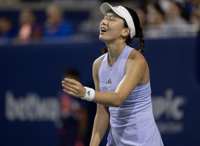 (260804) -- TORONTO, Aug. 4, 2026 (Xinhua) -- Wang Xinyu of China reacts during the first round of the women's singles match between Wang Xinyu of China and Daria Kasatkina of Australia at the 2026 National Bank Open tennis tournament in Toronto, Canada, Aug. 3, 2026. (Photo by Zou Zheng/Xinhua)