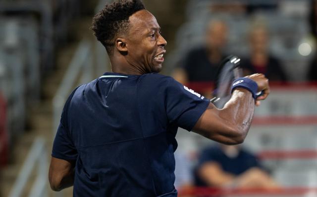 (260804) -- MONTREAL, Aug. 4, 2026 (Xinhua) -- Gael Monfils of France hits a return against Kamil Majchrzak of Poland during the men's singles first round match at the 2026 National Bank Open tennis tournament in Montreal, Canada, Aug. 3, 2026. (Photo by Li Haitao/Xinhua)