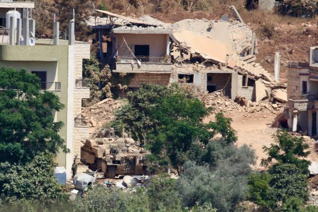 (260804) -- ZAWTAR AL-GHARBIYAH, Aug. 4, 2026 (Xinhua) -- This photo taken on Aug. 3, 2026 shows an Israeli military vehicle stationed in Zawtar al-Sharqiyah, southern Lebanon. The Lebanese army said on July 26 that continued Israeli attacks and violations of existing understandings are obstructing its deployment in southern Lebanon and delaying the return of residents to their border villages. (Photo by Ali Hashisho/Xinhua)