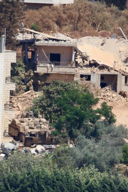 (260804) -- ZAWTAR AL-GHARBIYAH, Aug. 4, 2026 (Xinhua) -- This photo taken on Aug. 3, 2026 shows an Israeli military vehicle stationed in Zawtar al-Sharqiyah, southern Lebanon. The Lebanese army said on July 26 that continued Israeli attacks and violations of existing understandings are obstructing its deployment in southern Lebanon and delaying the return of residents to their border villages. (Photo by Ali Hashisho/Xinhua)