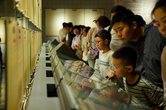 (260804) -- HARBIN, Aug. 4, 2026 (Xinhua) -- People visit the Exhibition Hall of Evidences of Crime Committed by Unit 731 of the Japanese Imperial Army in Pingfang District of Harbin, northeast China's Heilongjiang Province, Aug. 4, 2026. During the summer vacation, the Exhibition Hall of Evidences of Crime Committed by Unit 731 of the Japanese Imperial Army has greeted lots of visitors. 
   People tour the exhibition hall to view archival evidence exposing the germ warfare crimes perpetrated by notorious Japanese Unit 731 during World War II. 
   Unit 731 was a top-secret biological and chemical warfare research base established as the nerve center for Japanese biological warfare in China and Southeast Asia during WWII. At least 3,000 people were used in human experiments conducted by Unit 731, and more than 300,000 people in China were killed by Japan's biological weapons. (Xinhua/Zhang Tao)