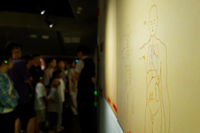 (260804) -- HARBIN, Aug. 4, 2026 (Xinhua) -- People visit the Exhibition Hall of Evidences of Crime Committed by Unit 731 of the Japanese Imperial Army in Pingfang District of Harbin, northeast China's Heilongjiang Province, Aug. 4, 2026. During the summer vacation, the Exhibition Hall of Evidences of Crime Committed by Unit 731 of the Japanese Imperial Army has greeted lots of visitors. 
   People tour the exhibition hall to view archival evidence exposing the germ warfare crimes perpetrated by notorious Japanese Unit 731 during World War II. 
   Unit 731 was a top-secret biological and chemical warfare research base established as the nerve center for Japanese biological warfare in China and Southeast Asia during WWII. At least 3,000 people were used in human experiments conducted by Unit 731, and more than 300,000 people in China were killed by Japan's biological weapons. (Xinhua/Zhang Tao)