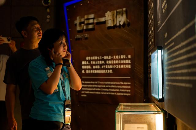 (260804) -- HARBIN, Aug. 4, 2026 (Xinhua) -- People visit the Exhibition Hall of Evidences of Crime Committed by Unit 731 of the Japanese Imperial Army in Pingfang District of Harbin, northeast China's Heilongjiang Province, Aug. 4, 2026. During the summer vacation, the Exhibition Hall of Evidences of Crime Committed by Unit 731 of the Japanese Imperial Army has greeted lots of visitors. 
   People tour the exhibition hall to view archival evidence exposing the germ warfare crimes perpetrated by notorious Japanese Unit 731 during World War II. 
   Unit 731 was a top-secret biological and chemical warfare research base established as the nerve center for Japanese biological warfare in China and Southeast Asia during WWII. At least 3,000 people were used in human experiments conducted by Unit 731, and more than 300,000 people in China were killed by Japan's biological weapons. (Xinhua/Zhang Tao)