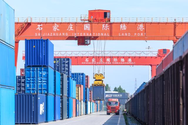 (260804) -- SHIJIAZHUANG, Aug. 4, 2026 (Xinhua) -- This photo taken on Aug. 4, 2026 shows a container loading site of the Shijiazhuang international land port in north China's Hebei Province. Shijiazhuang international land port in north China's Hebei Province handled a total of 814 China-Europe and China-Central Asia freight train trips in the first half of 2026, up 42.06 percent year on year. (Photo by Liang Zidong/Xinhua)