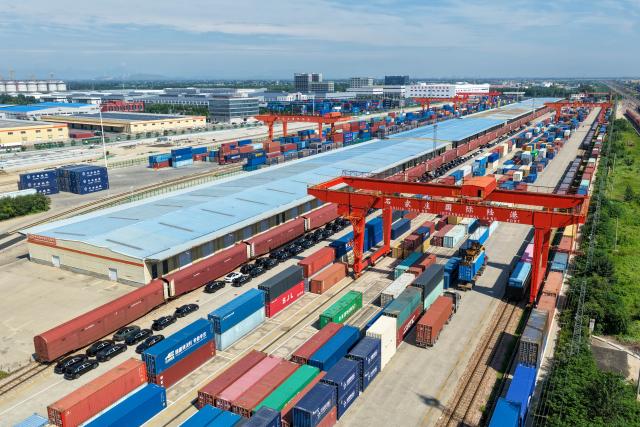 (260804) -- SHIJIAZHUANG, Aug. 4, 2026 (Xinhua) -- This aerial drone photo taken on Aug. 4, 2026 shows a container loading site of the Shijiazhuang international land port in north China's Hebei Province. Shijiazhuang international land port in north China's Hebei Province handled a total of 814 China-Europe and China-Central Asia freight train trips in the first half of 2026, up 42.06 percent year on year. (Photo by Liang Zidong/Xinhua)