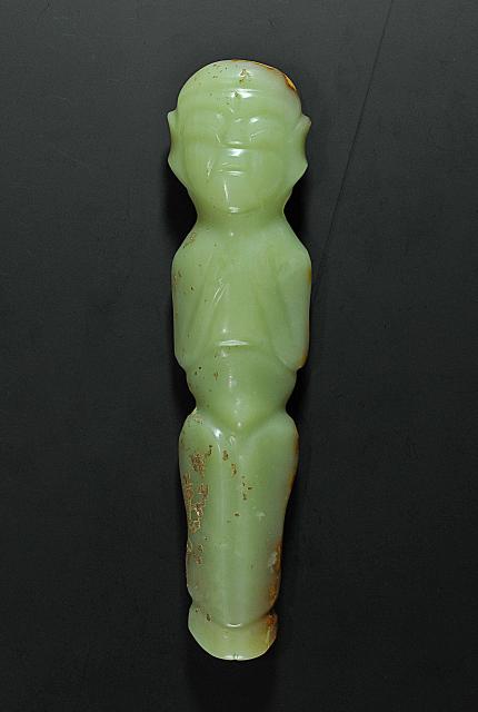 (260804) -- CHAOYANG, Aug. 4, 2026 (Xinhua) -- An undated file photo shows a jade figurine unearthed from the Niuheliang national archaeological relic site park in Chaoyang City, northeast China's Liaoning Province. The Niuheliang national archaeological relic site park was built on the Niuheliang site, a large-scale prehistoric ritual and burial complex featuring the temple of the goddess, altars and stone tombs. Dating back more than 5,000 years, the site unearthed stone tools, pottery and jade artifacts with dragon, phoenix and human motifs, reflecting the rituals and beliefs of the Hongshan culture. (Photo by Pang Lei/Xinhua)