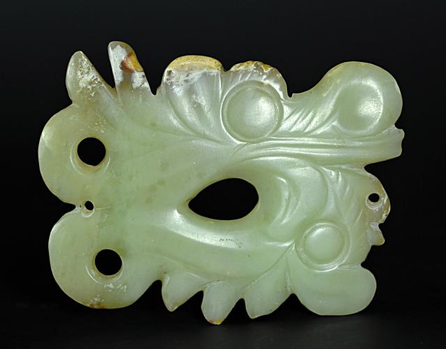 (260804) -- CHAOYANG, Aug. 4, 2026 (Xinhua) -- An undated file photo shows a jade artifact unearthed from the Niuheliang national archaeological relic site park in Chaoyang City, northeast China's Liaoning Province. The Niuheliang national archaeological relic site park was built on the Niuheliang site, a large-scale prehistoric ritual and burial complex featuring the temple of the goddess, altars and stone tombs. Dating back more than 5,000 years, the site unearthed stone tools, pottery and jade artifacts with dragon, phoenix and human motifs, reflecting the rituals and beliefs of the Hongshan culture. (Photo by Pang Lei/Xinhua)