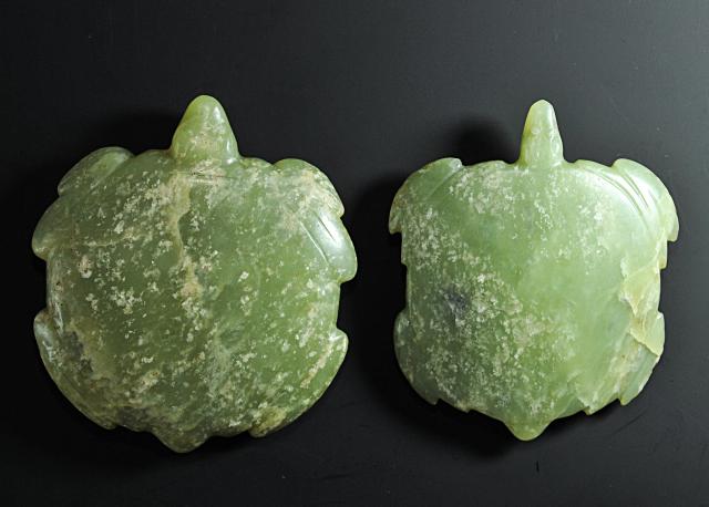 (260804) -- CHAOYANG, Aug. 4, 2026 (Xinhua) -- An undated file photo shows jade artifacts unearthed from the Niuheliang national archaeological relic site park in Chaoyang City, northeast China's Liaoning Province. The Niuheliang national archaeological relic site park was built on the Niuheliang site, a large-scale prehistoric ritual and burial complex featuring the temple of the goddess, altars and stone tombs. Dating back more than 5,000 years, the site unearthed stone tools, pottery and jade artifacts with dragon, phoenix and human motifs, reflecting the rituals and beliefs of the Hongshan culture. (Photo by Pang Lei/Xinhua)