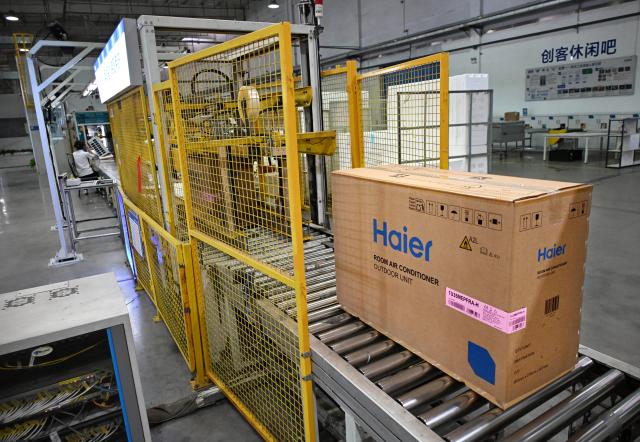 (260804) -- QINGDAO, Aug. 4, 2026 (Xinhua) -- Air conditioners to be shipped to Europe are pictured at a Haier factory in Jiaozhou, east China's Shandong Province, Aug. 4, 2026. As unprecedented heatwaves scorch Europe this summer, demand for affordable and energy-efficient air conditioners is rising.
   As a globally renowned home appliance manufacturer, China's Haier has seen a surge in orders from Europe. The company has adjusted its production plans for the European market, stepping up the manufacturing of air conditioner orders to meet international market demand. (Xinhua/Li Ziheng)