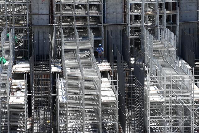 (260804) -- ZHANGYE, Aug. 4, 2026 (Xinhua) -- Workers work at the construction site of a pumped-storage power station in Zhangye, northwest China's Gansu Province, Aug. 4, 2026. The construction of the power station started in 2022, and all the four 350,000-kW reversible pump-turbine units are expected to be fully put into operation by 2029. (Xinhua/Fan Peishen)