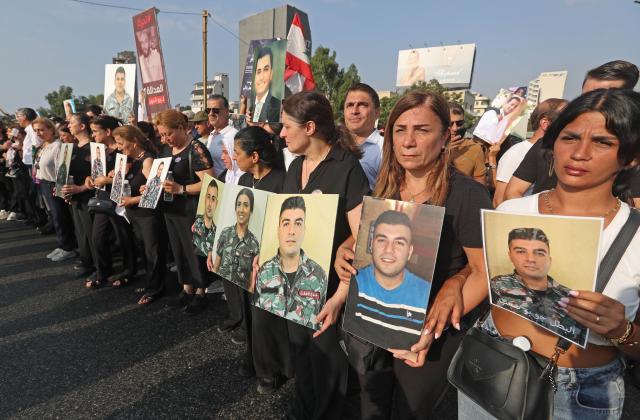(260804) -- BEIRUT, Aug. 4, 2026 (Xinhua) -- People hold portraits of the victims in commemoration of the sixth anniversary of the 2020 Beirut port blasts in Beirut, Lebanon, Aug. 4, 2026. (Xinhua/Bilal Jawich)