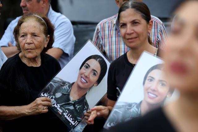 (260804) -- BEIRUT, Aug. 4, 2026 (Xinhua) -- People hold portraits of the victims in commemoration of the sixth anniversary of the 2020 Beirut port blasts in Beirut, Lebanon, Aug. 4, 2026. (Xinhua/Bilal Jawich)