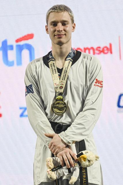 (260805) -- JAKARTA, Aug. 5, 2026 (Xinhua) -- Gold medalist Matthew Summerfield of Australia poses during awarding ceremony of the men's Kyorugi -68kg final match of Taekwondo at the 8th Asian Taekwondo Indonesia Open Championships 2026 in Jakarta, Indonesia, Aug. 4, 2026. (Xinhua/Agung Kuncahya B.)
