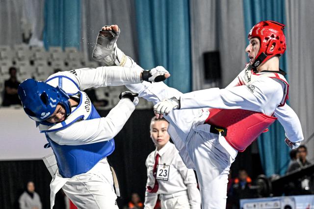 (260805) -- JAKARTA, Aug. 5, 2026 (Xinhua) -- Vladislav Budin (R) of Russia competes with Ardian Kaisaer of Indonesia during the men's Kyorugi -87kg final match of Taekwondo at the 8th Asian Taekwondo Indonesia Open Championships 2026 in Jakarta, Indonesia, Aug. 4, 2026. (Xinhua/Agung Kuncahya B.)