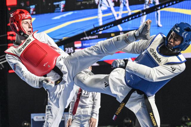(260805) -- JAKARTA, Aug. 5, 2026 (Xinhua) -- Vladislav Budin (L) of Russia competes with Ardian Kaisaer of Indonesia during the men's Kyorugi -87kg final match of Taekwondo at the 8th Asian Taekwondo Indonesia Open Championships 2026 in Jakarta, Indonesia, Aug. 4, 2026. (Xinhua/Agung Kuncahya B.)