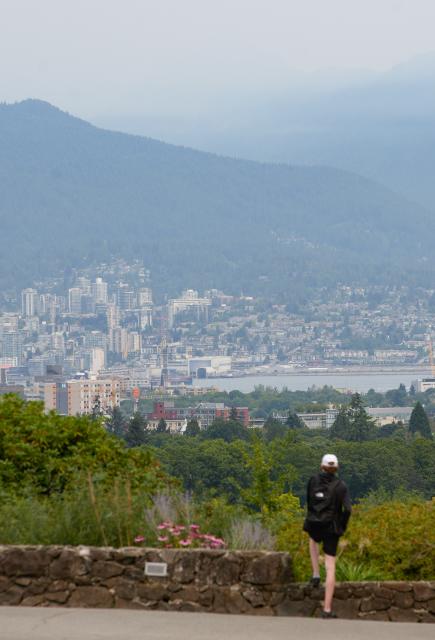 (260805) -- VANCOUVER, Aug. 5, 2026 (Xinhua) -- A man looks at the view as wildfire smoke blankets the sky over Vancouver, British Columbia, Canada, Aug. 4, 2026. Amid extreme heatwaves and record-breaking drought, wildfires have broken out in many parts of Canada, reducing air quality and visibility in the affected areas. (Photo by Liang Sen/Xinhua)