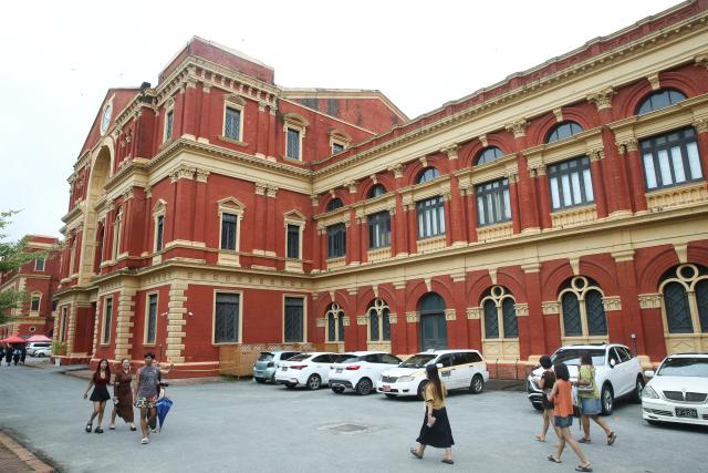 (260805) -- YANGON, Aug. 5, 2026 (Xinhua) -- People visit the Secretariat building in Yangon, Myanmar, on Aug. 4, 2026. A total of 6,105 buildings over 100 years old are now under conservation as heritage buildings nationwide in Myanmar, including 153 in the Yangon Region, the state-owned daily The Global New Light of Myanmar reported on Tuesday. (Xinhua/Myo Kyaw Soe)
