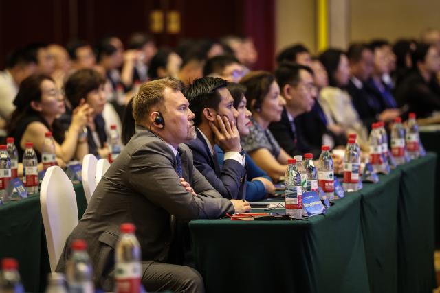 (260805) -- CHAOYANG, Aug. 5, 2026 (Xinhua) -- Guests attend the opening ceremony of the 2026 Conference on Hongshan Culture in Chaoyang City, northeast China's Liaoning Province, Aug. 5, 2026. Themed on "Hongshan Culture: A Dialogue Between Eras and Civilizations," the 2026 Conference on Hongshan Culture kicked off here on Wednesday. (Xinhua/Pan Yulong)