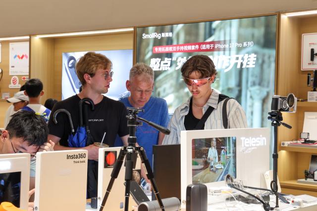 (260805) -- SHENZHEN, Aug. 5, 2026 (Xinhua) -- Foreign tourists experience AI sports glasses at an INNO100 shop in Shenzhen, south China's Guangdong Province, Aug. 3, 2026. With the deep application of the achievements of emerging industries, many inbound foreign tourists choose science and technology tour as the theme of their journey in the Chinese cities. 
  In Shenzhen, foreign tourists are attracted by AI applications and technology scenarios in daily life, such as AI glasses, smart robots and unmanned delivery service. (Xinhua/Liang Xu)