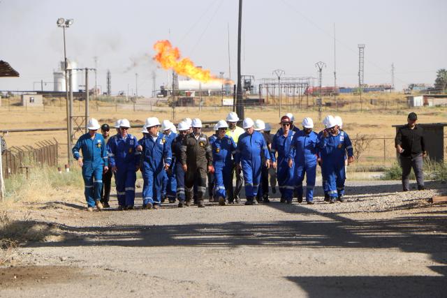 (260805) -- HASAKAH, Aug. 5, 2026 (Xinhua) -- Officials and engineers tour the Rmelan oil fields in Hasakah province, northeastern Syria, Aug. 4, 2026. Officials said rehabilitation projects are expected to modernize production facilities and gradually raise output at the country's largest oil fields. (Str/Xinhua)