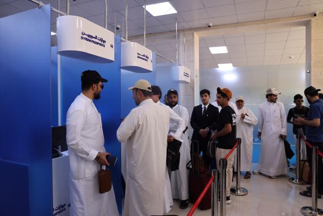 (260805) -- DEIR AL-ZOUR, Aug. 5, 2026 (Xinhua) -- Passengers wait to receive passport checks after the first direct commercial flight from Kuwait landed at Deir al-Zour International Airport in Deir al-Zour province, eastern Syria, Aug. 5, 2026. The first direct commercial flight from Kuwait landed Wednesday at Deir al-Zour International Airport in eastern Syria, marking the return of international commercial air services to the airport after more than a decade. (Str/Xinhua)