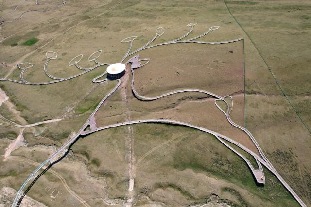(260806) -- BEIJING, Aug. 6, 2026 (Xinhua) -- An aerial drone photo taken on Aug. 5, 2026 shows a view of the Divine Deer Park in Sunan Yugur Autonomous County, northwest China's Gansu Province. During this summer, hundreds of red deer are seen resting and foraging on the grassland at the Divine Deer Park, a deer farm located at the foot of the Qilian Mountains in northwest China. 
   In recent years, local government has leveraged the deer farm, along with the scenic grasslands of the Qilian Mountains and Yugur ethnic customs, to develop an eco-tourism destination that integrates leisure, sightseeing and science education. (Xinhua/Fan Peishen)