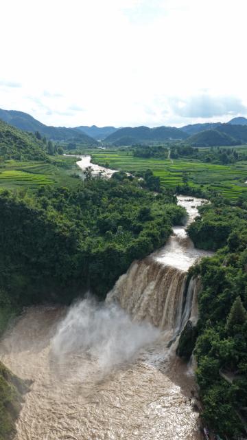 (260806) -- LUOPING, Aug. 6, 2026 (Xinhua) -- An aerial drone photo taken on Aug. 5, 2026 shows a view of the Jiulong Waterfalls in Luoping County, southwest China's Yunnan Province. Due to continuous heavy rainfall, the Jiulong Waterfalls in Luoping County have entered their high-flow season. (Photo by Mao Hong/Xinhua)