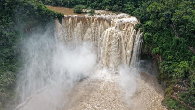 (260806) -- LUOPING, Aug. 6, 2026 (Xinhua) -- An aerial drone photo taken on Aug. 5, 2026 shows a view of the Jiulong Waterfalls in Luoping County, southwest China's Yunnan Province. Due to continuous heavy rainfall, the Jiulong Waterfalls in Luoping County have entered their high-flow season. (Photo by Mao Hong/Xinhua)