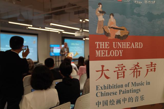 (260806) -- NEW YORK, Aug. 6, 2026 (Xinhua) -- People attend the opening ceremony of "The Unheard Melody: Exhibition of Music in Chinese Paintings" in New York, the United States, Aug. 5, 2026. The exhibition opened here on Wednesday. Featuring musical imagery from the art of ancient Chinese painting, it showcases a curated selection of masterpieces inspired by music from the Song Dynasty (960-1127), and invites visitors to explore the sounds and stories embedded within the artworks. (Xinhua/Zhang Fengguo)