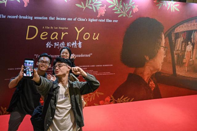 (260806) -- JAKARTA, Aug. 6, 2026 (Xinhua) -- Viewers take selfies at the premiere of the Chinese film "Dear You" in Jakarta, Indonesia, Aug. 5, 2026. The recent hit Chinese film "Dear You" held its premiere here on Wednesday evening, attracting audiences from the political, business, and cultural sectors of both China and Indonesia. (Xinhua/Agung Kuncahya B.)